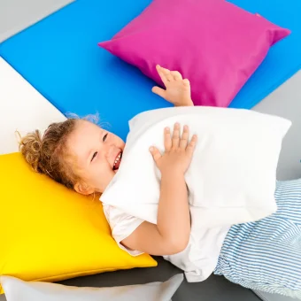 Playlearn's Cozy Pillow Cushions. Available in pink, yellow, blue, and lime.